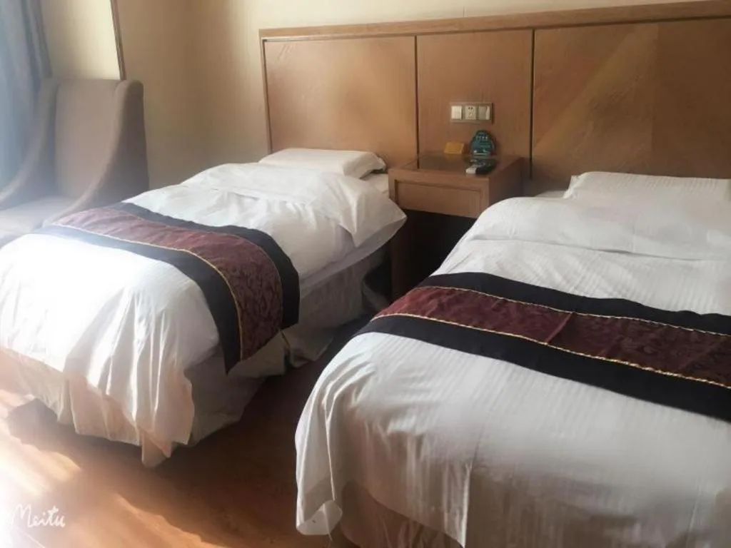 Bed in GreenTree Inn Jiangsu Wuxi Huishan High-Speed Rail Qianzhou Chongwen Road Business Hotel