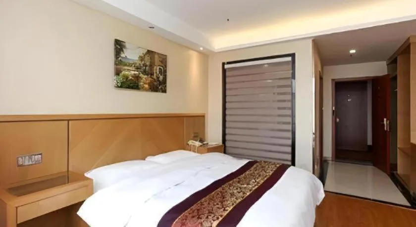 Bed in GreenTree Inn Jiangsu Wuxi Huishan High-Speed Rail Qianzhou Chongwen Road Business Hotel