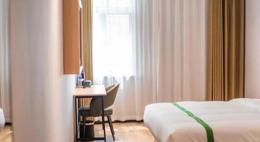 Bed in GreenTree Inn Qingdao Licang Shuyan Road Daweng Square Express Hotel