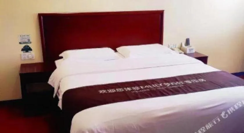 Bed in GreenTree Inn Qingdao Licang Shuyan Road Daweng Square Express Hotel