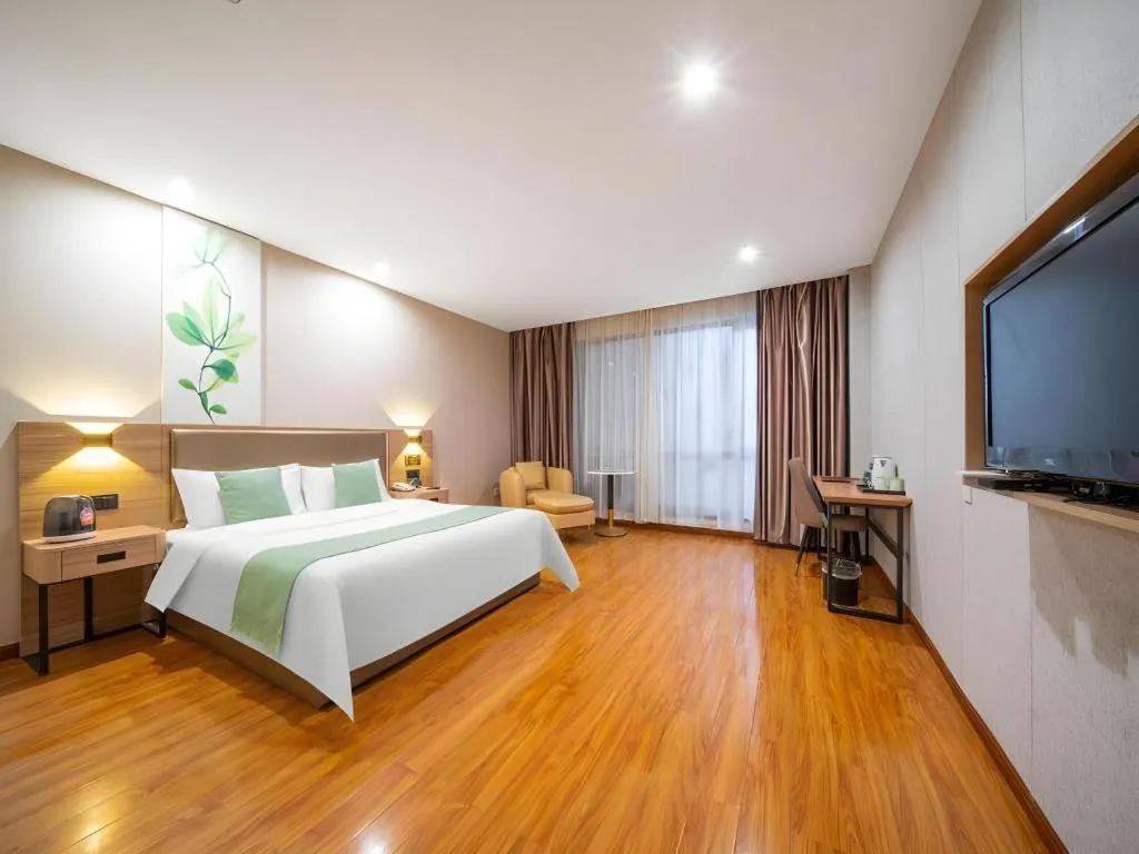 Bed in GreenTree Inn Jining Yanzhou Jiuzhou Fangyuan Business Hotel