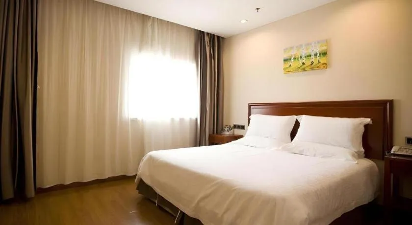 Bed in GreenTree Inn Jining Yanzhou Jiuzhou Fangyuan Business Hotel