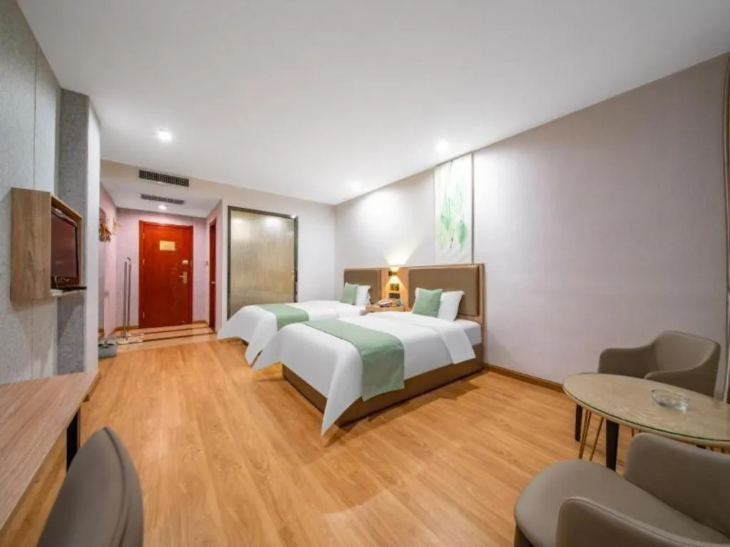 Bed in GreenTree Inn Jining Yanzhou Jiuzhou Fangyuan Business Hotel