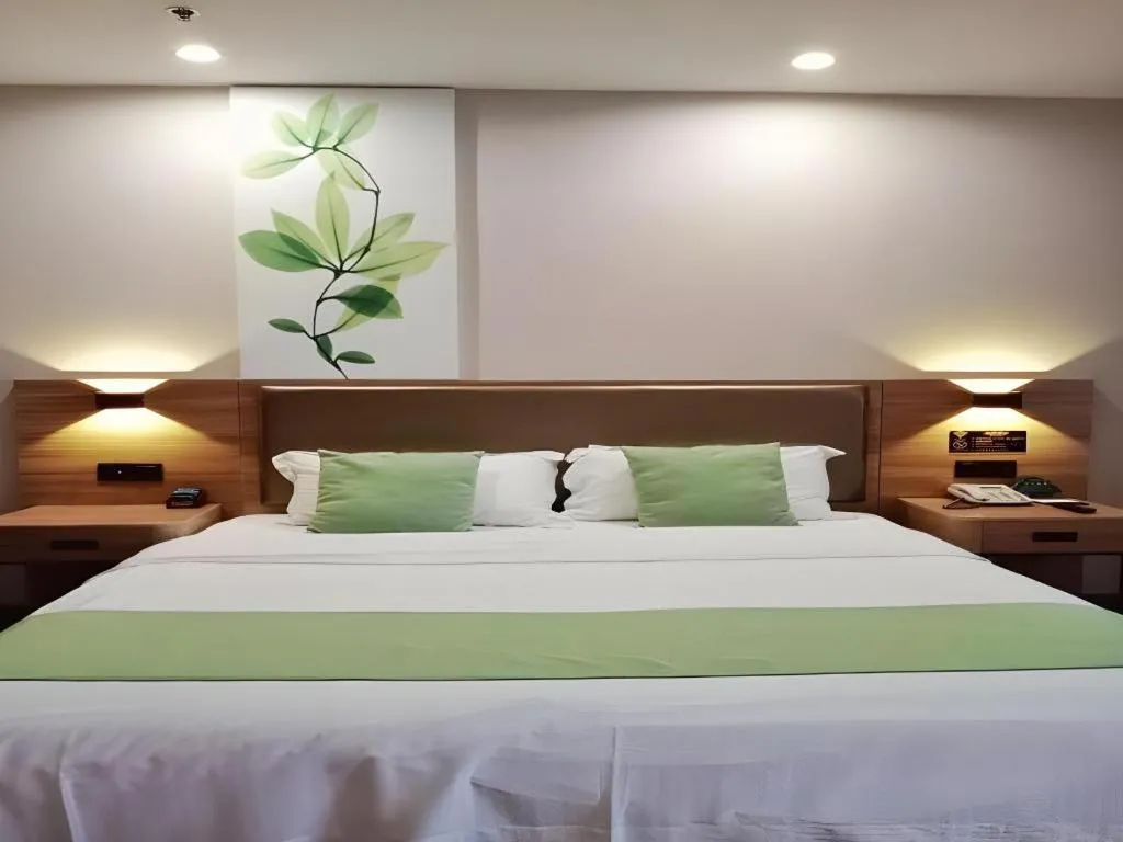 Bed in GreenTree Inn Jining Yanzhou Jiuzhou Fangyuan Business Hotel