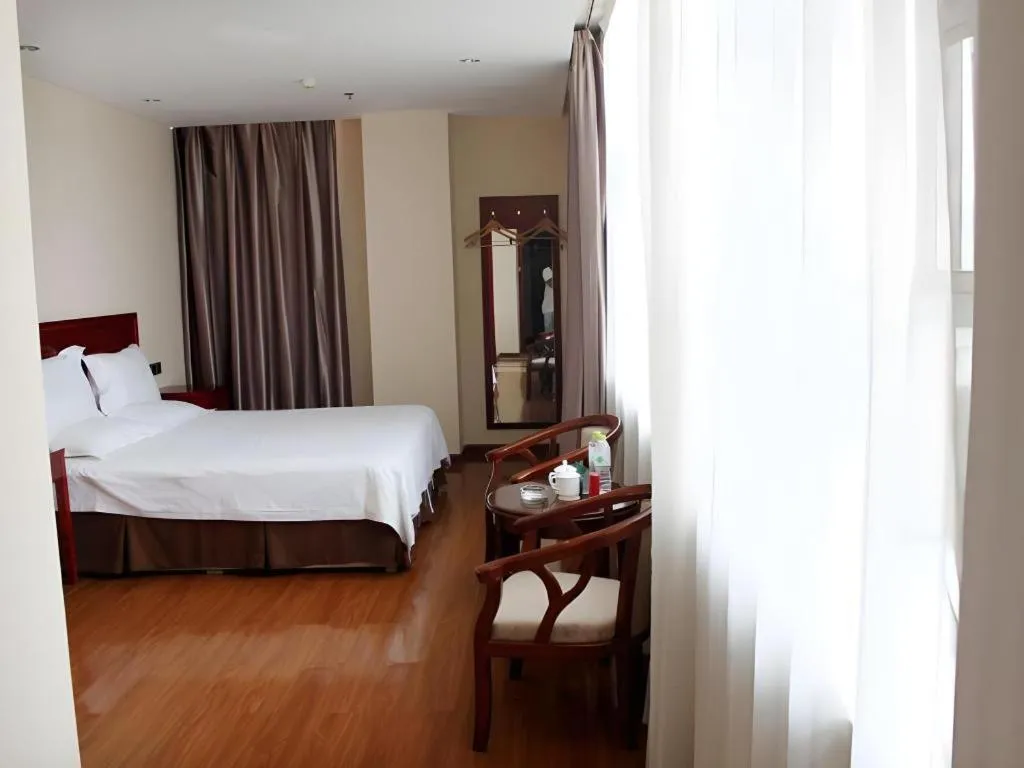 Bed in GreenTree Inn Jining Yanzhou Jiuzhou Fangyuan Business Hotel