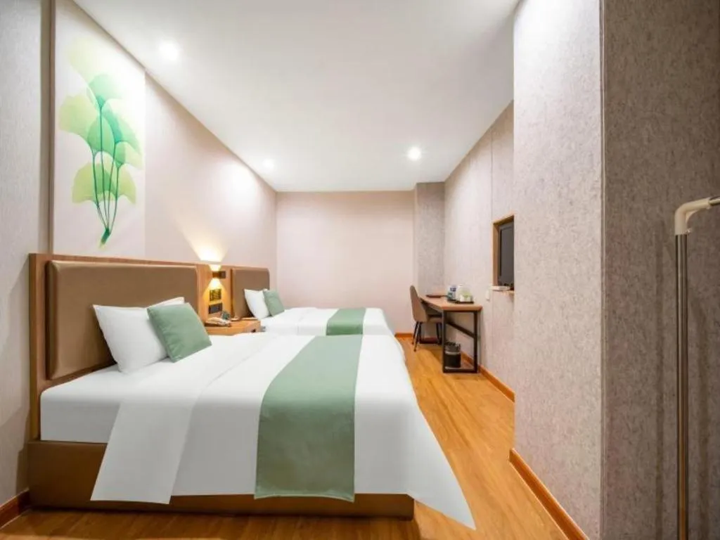 Bed in GreenTree Inn Jining Yanzhou Jiuzhou Fangyuan Business Hotel