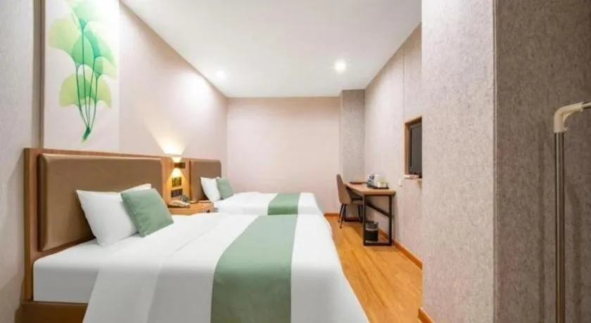 Bed in GreenTree Inn Jining Yanzhou Jiuzhou Fangyuan Business Hotel