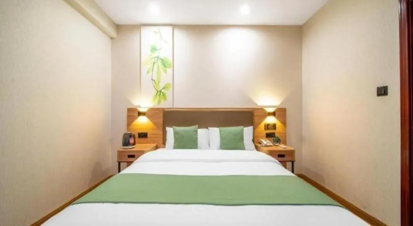 Bed in GreenTree Inn Jining Yanzhou Jiuzhou Fangyuan Business Hotel