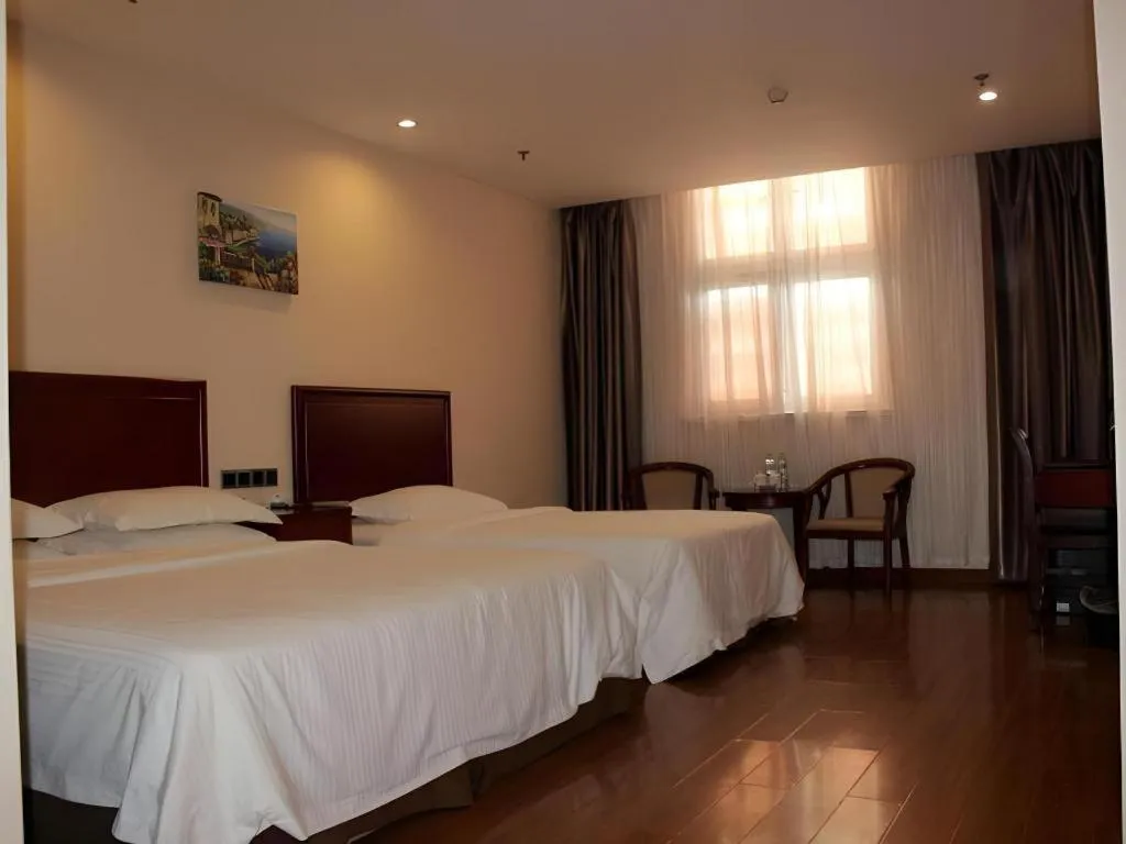 Bed in GreenTree Inn Jining Yanzhou Jiuzhou Fangyuan Business Hotel
