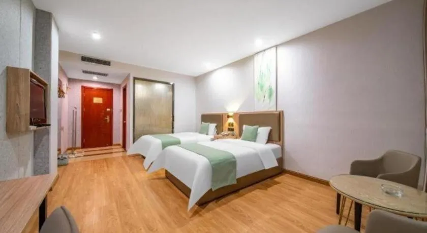 Bed in GreenTree Inn Jining Yanzhou Jiuzhou Fangyuan Business Hotel