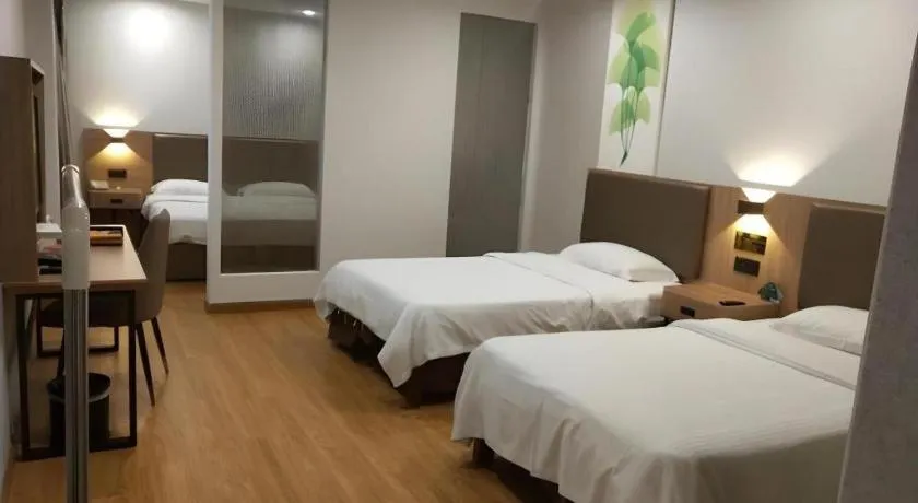 Bed in GreenTree Inn Jining Yanzhou Jiuzhou Fangyuan Business Hotel