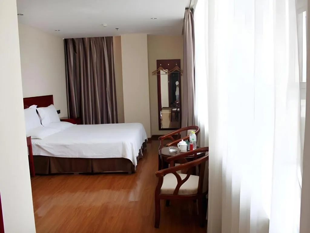 Bed in GreenTree Inn Jining Yanzhou Jiuzhou Fangyuan Business Hotel