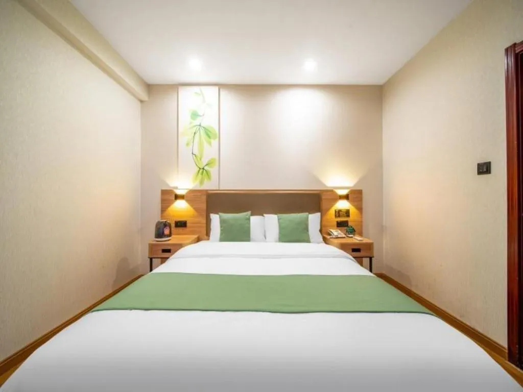 Bed in GreenTree Inn Jining Yanzhou Jiuzhou Fangyuan Business Hotel