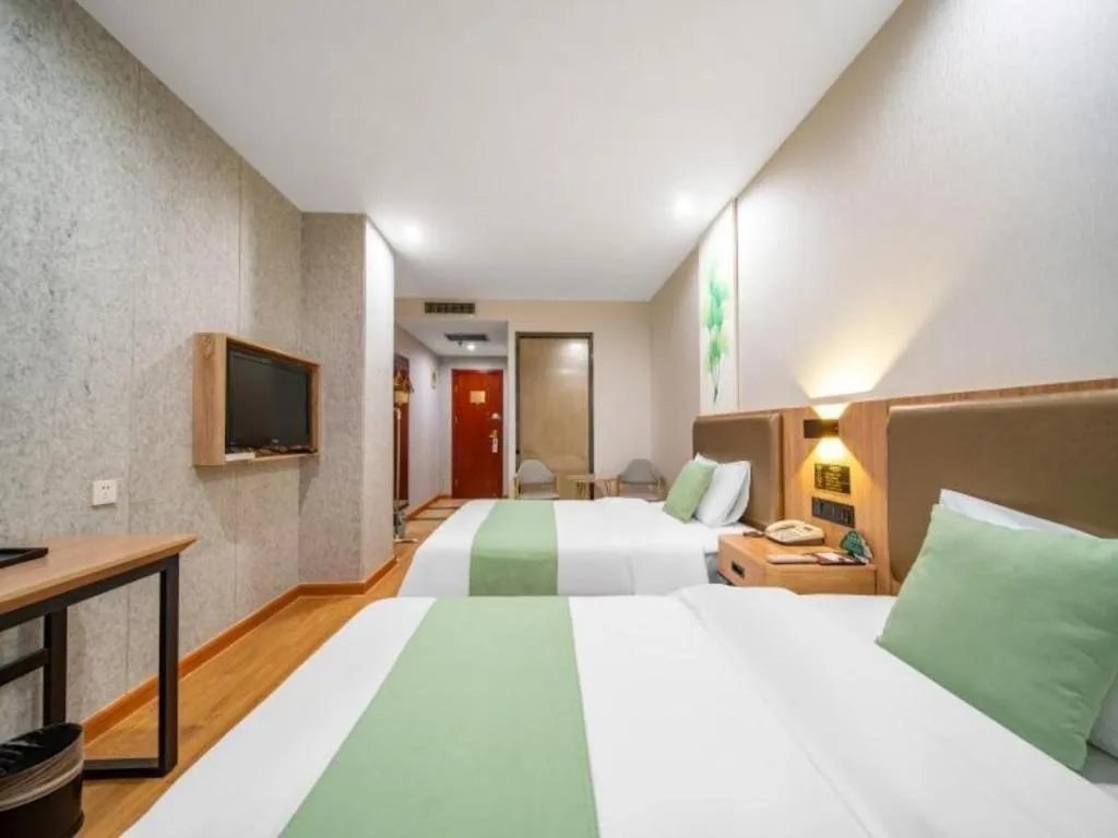 Bed in GreenTree Inn Jining Yanzhou Jiuzhou Fangyuan Business Hotel