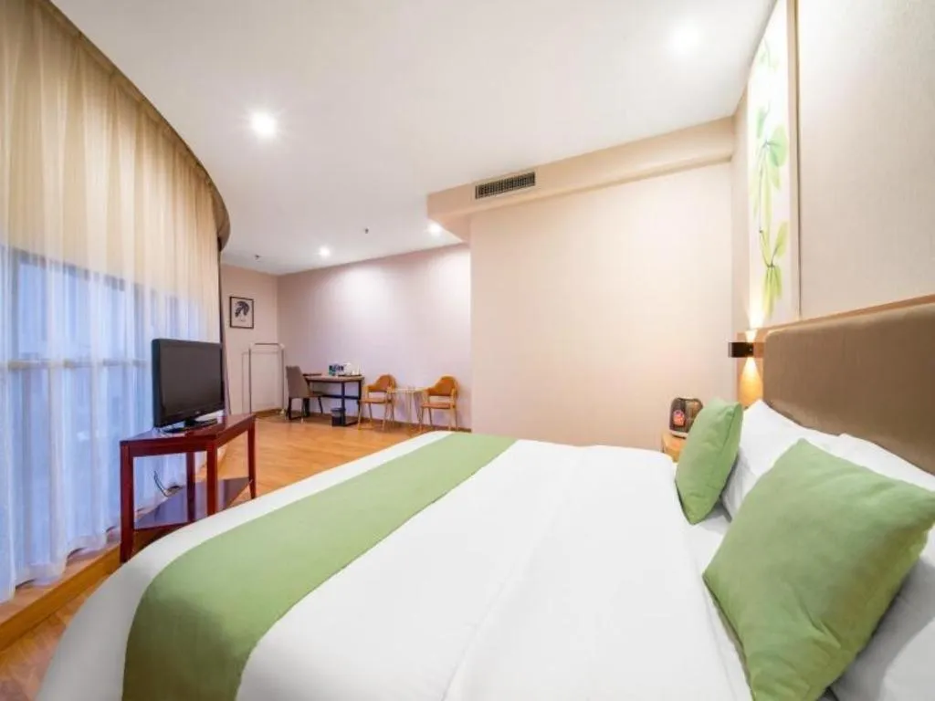 Bed in GreenTree Inn Jining Yanzhou Jiuzhou Fangyuan Business Hotel