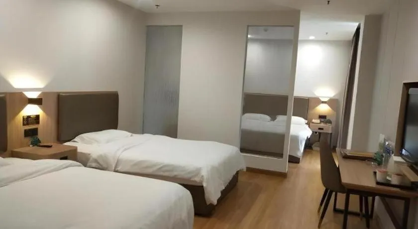 Bed in GreenTree Inn Jining Yanzhou Jiuzhou Fangyuan Business Hotel
