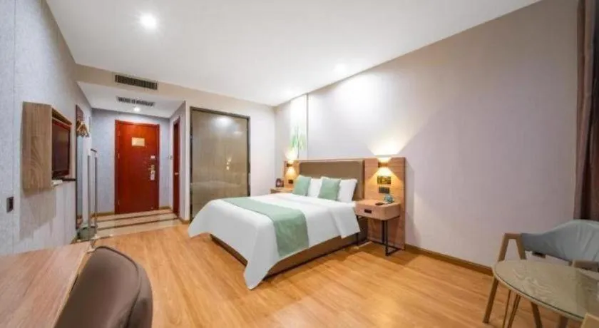 Bed in GreenTree Inn Jining Yanzhou Jiuzhou Fangyuan Business Hotel