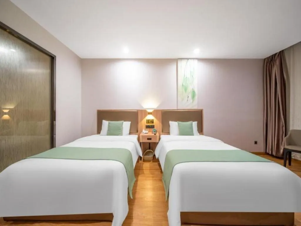 Bed in GreenTree Inn Jining Yanzhou Jiuzhou Fangyuan Business Hotel