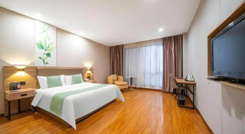 Bed in GreenTree Inn Jining Yanzhou Jiuzhou Fangyuan Business Hotel