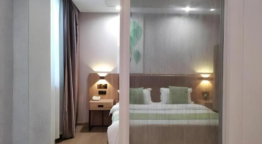Bed in GreenTree Inn Jining Yanzhou Jiuzhou Fangyuan Business Hotel