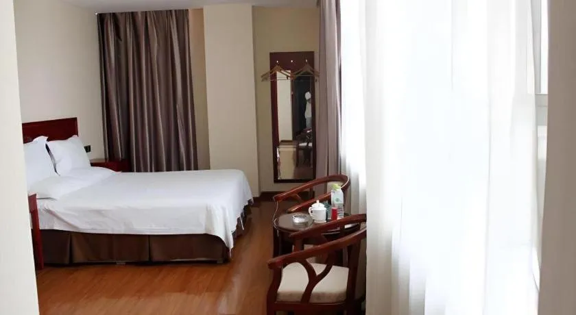Bed in GreenTree Inn Jining Yanzhou Jiuzhou Fangyuan Business Hotel