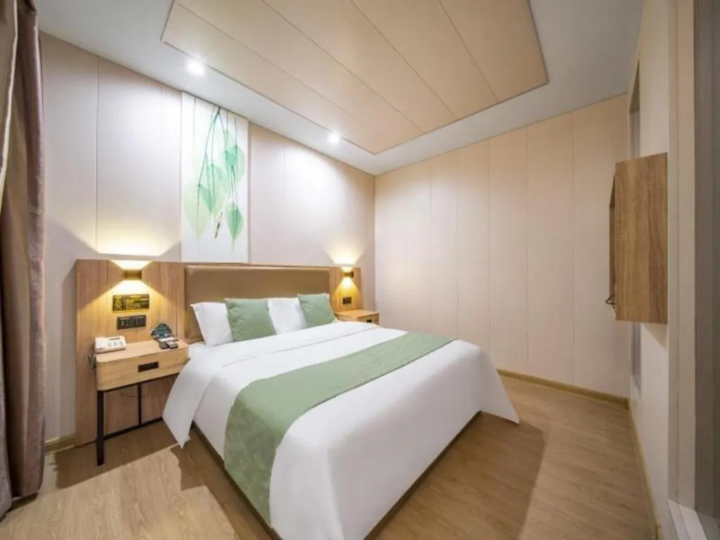 Bed in GreenTree Inn Jining Yanzhou Jiuzhou Fangyuan Business Hotel