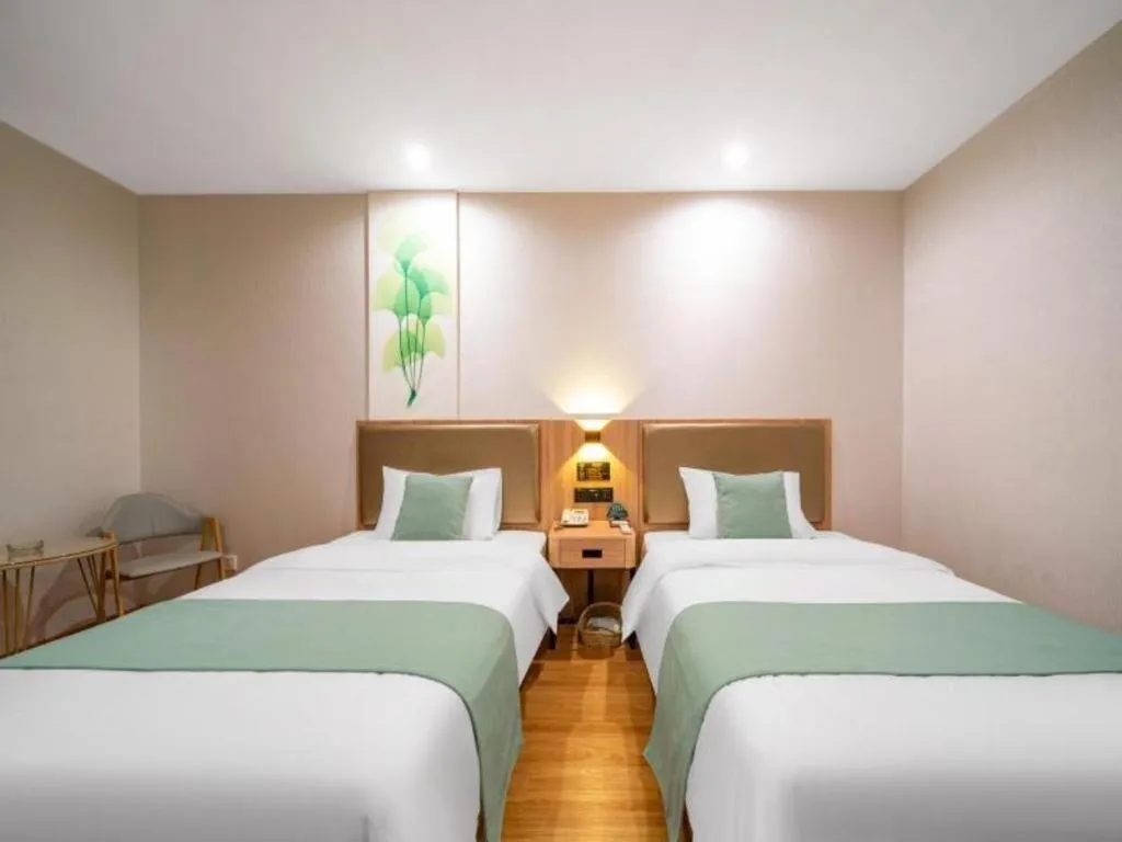 Bed in GreenTree Inn Jining Yanzhou Jiuzhou Fangyuan Business Hotel