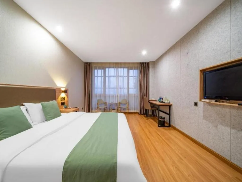 Bed in GreenTree Inn Jining Yanzhou Jiuzhou Fangyuan Business Hotel
