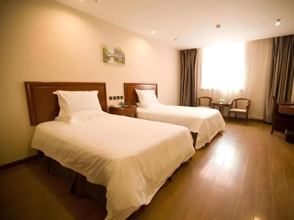 Bed in GreenTree Inn Jining Yanzhou Jiuzhou Fangyuan Business Hotel