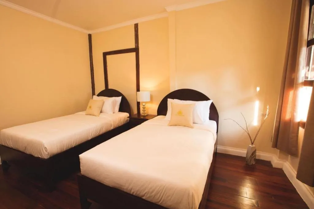 Bed in Le Luxe Boutique Hotel