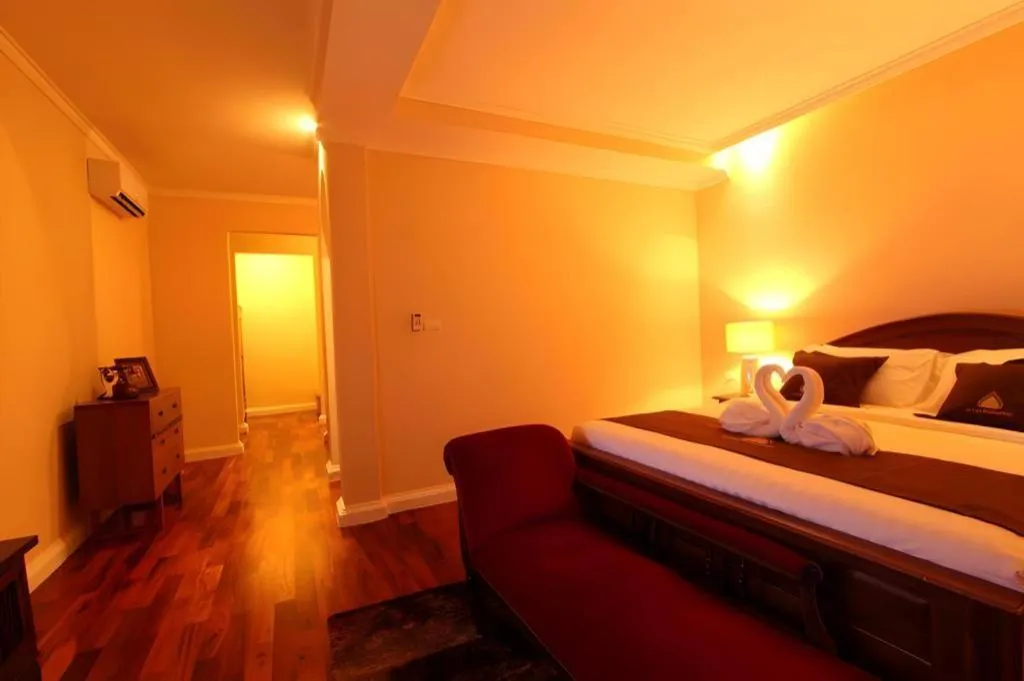 Bed in Le Luxe Boutique Hotel