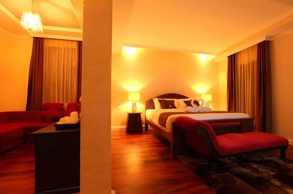 Bed in Le Luxe Boutique Hotel