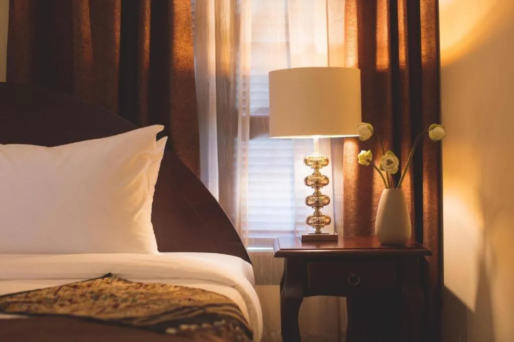 Bed in Le Luxe Boutique Hotel