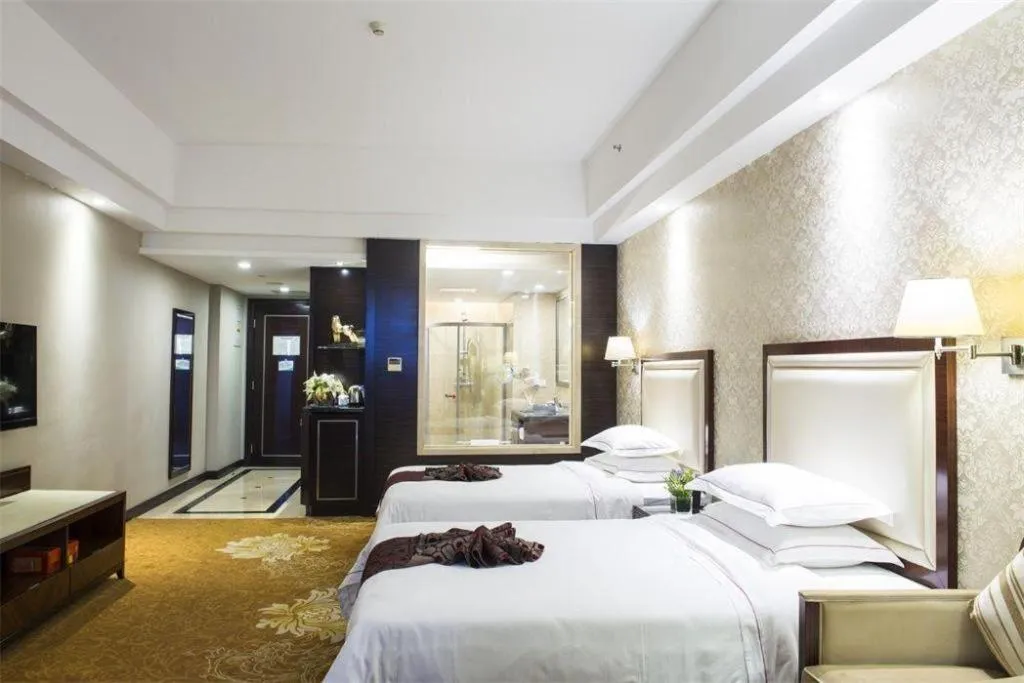 Bed in Country Garden Phoenix Hotel Maoming