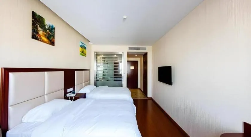 Bed in GreenTree Inn Jiangsu Zhangjiagang Jingang Town Darunfa Express Hotel