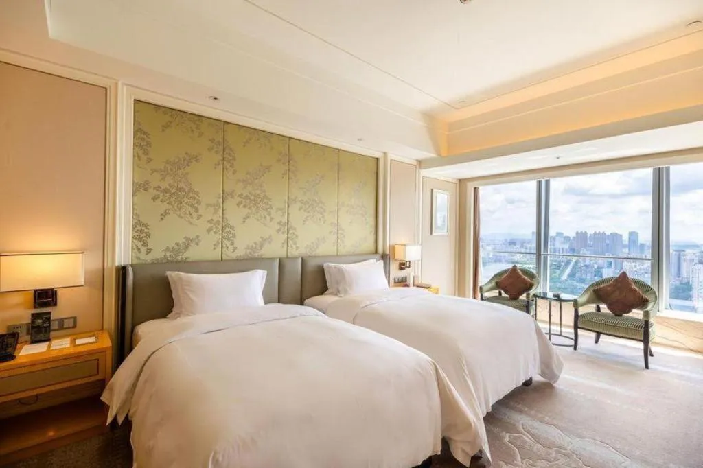 Bed in Ming Du Lakeside Hotel Nanning