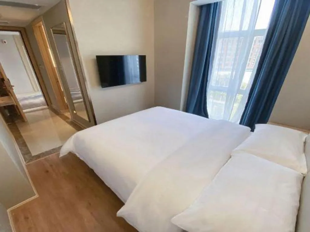 Bed in Vienna Hotel Tianjin Huaming