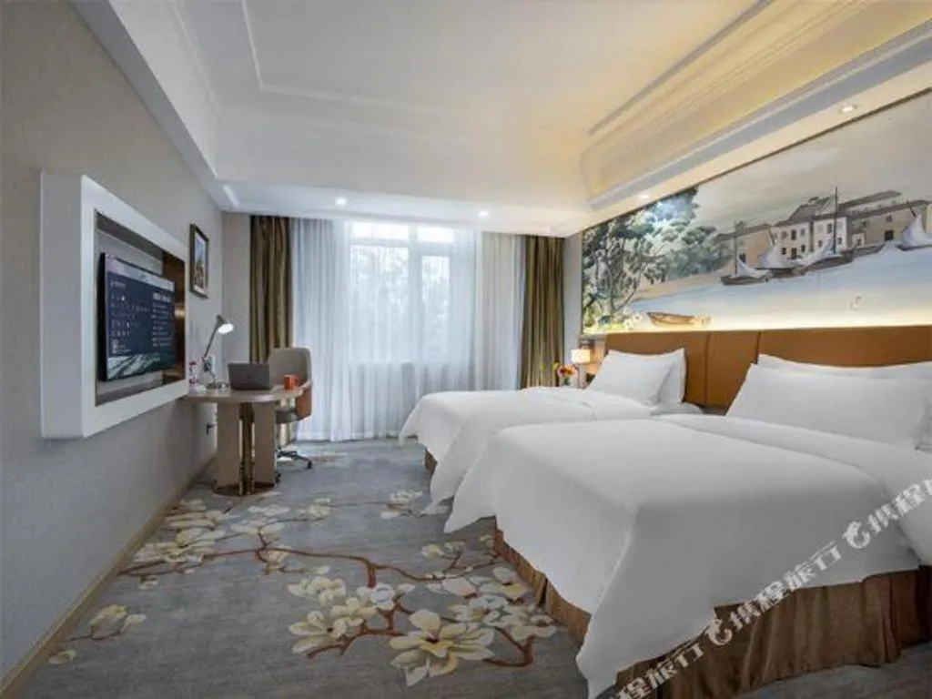 Bed in Vienna Hotel Tianjin Huaming