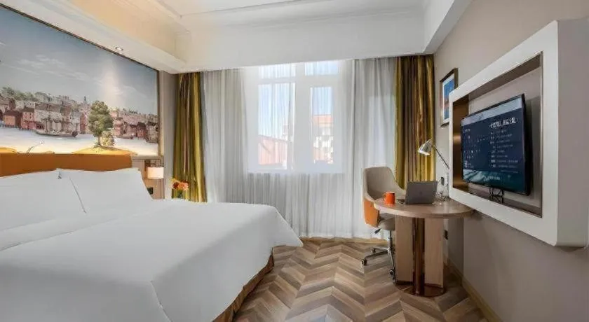 Bed in Vienna Hotel Tianjin Huaming