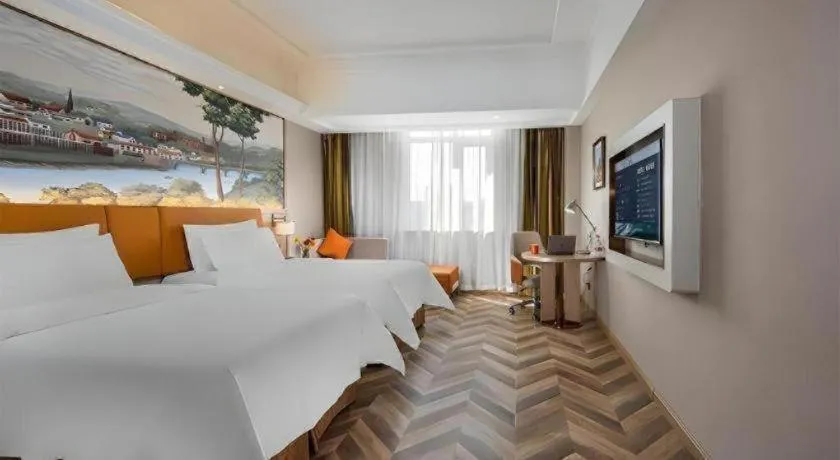 Bed in Vienna Hotel Tianjin Huaming