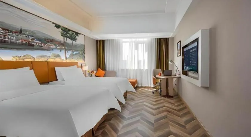 Bed in Vienna Hotel Tianjin Huaming