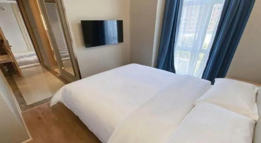 Bed in Vienna Hotel Tianjin Huaming