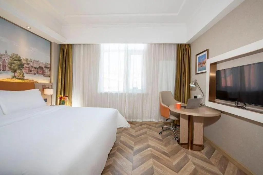 Bed in Vienna Hotel Tianjin Huaming