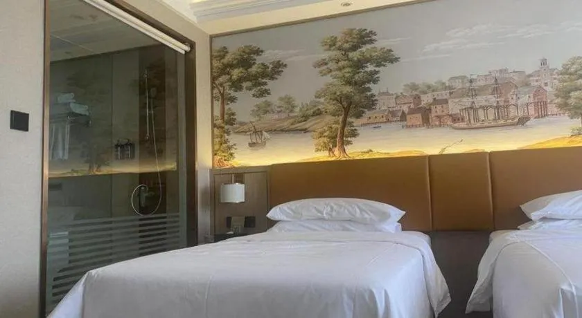 Bed in Vienna Hotel Tianjin Huaming