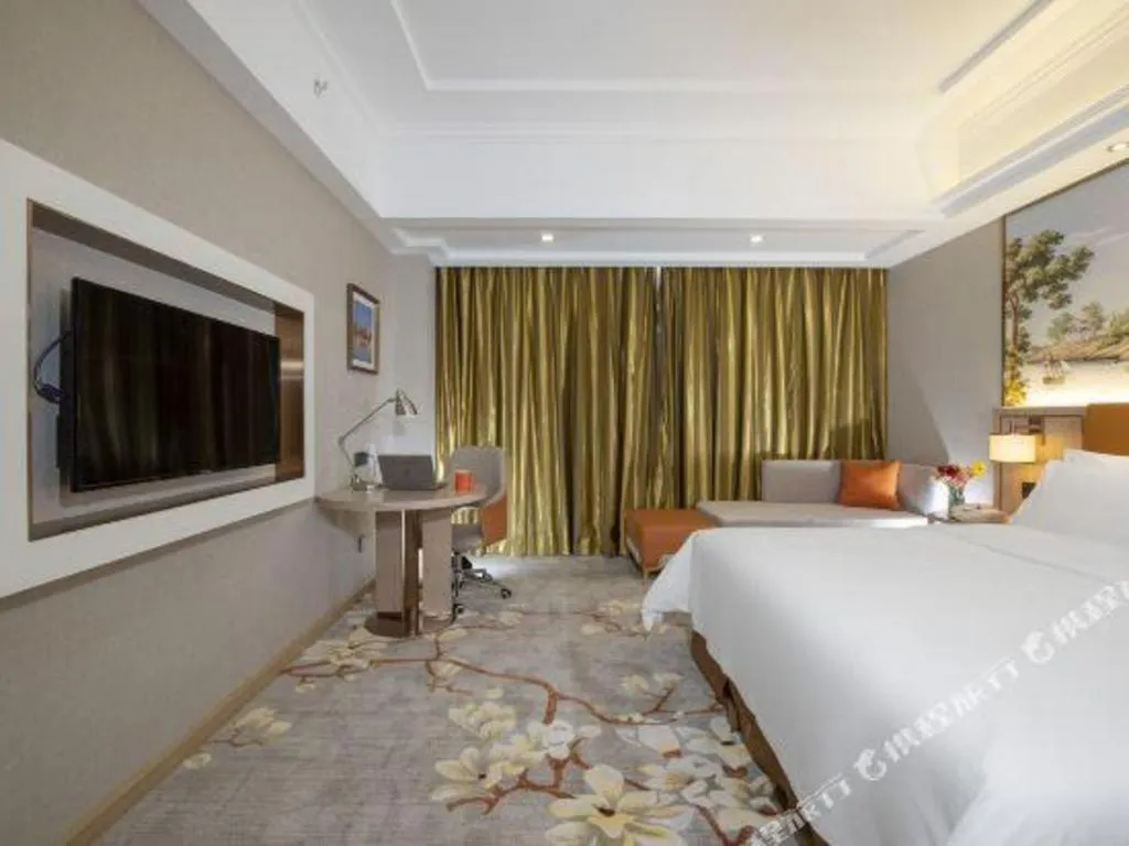 Bed in Vienna Hotel Tianjin Huaming