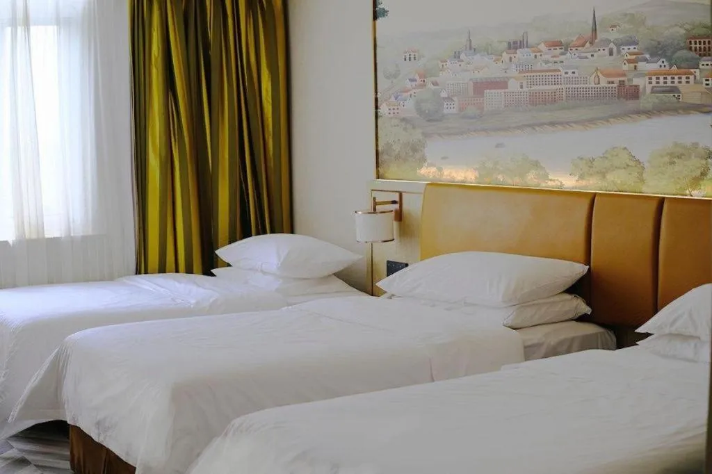 Bed in Vienna Hotel Tianjin Huaming