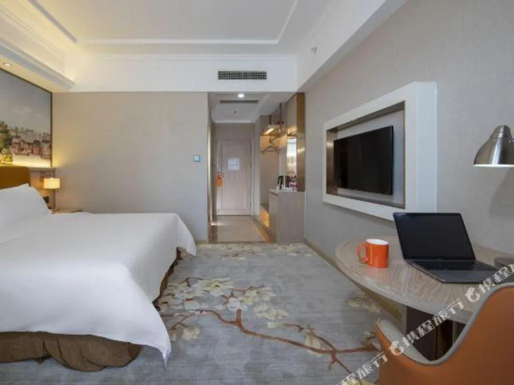 Bed in Vienna Hotel Tianjin Huaming