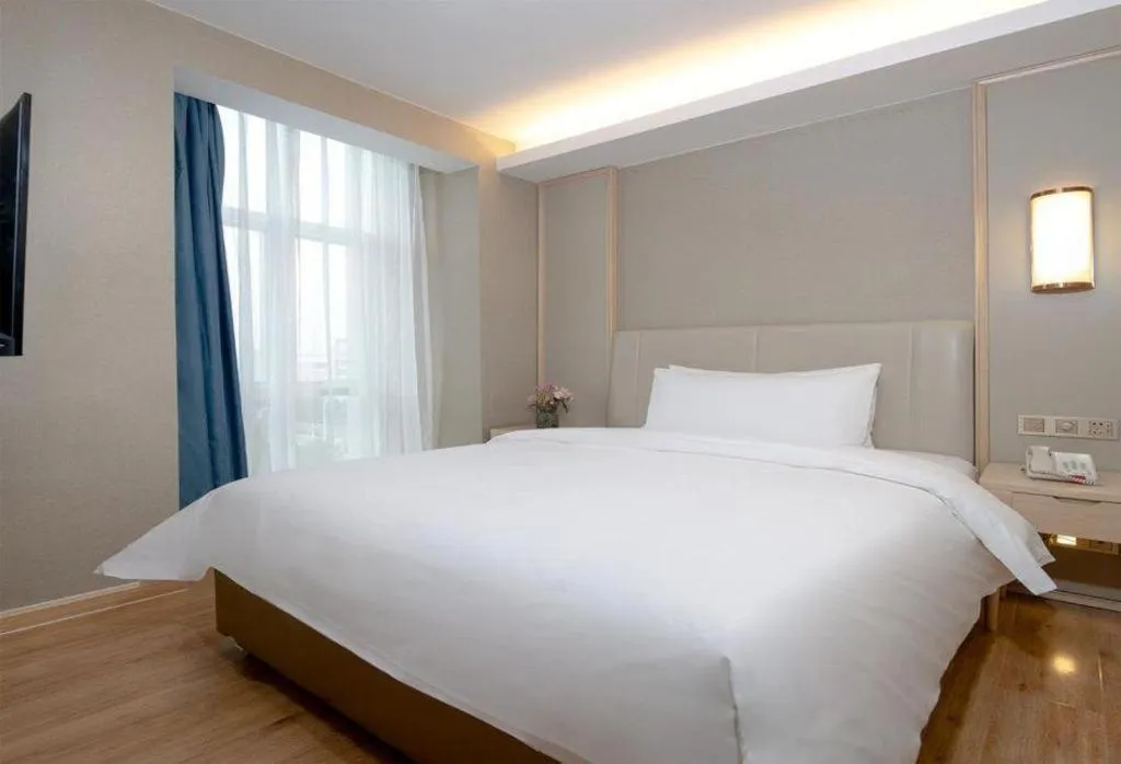 Bed in Vienna Hotel Tianjin Huaming