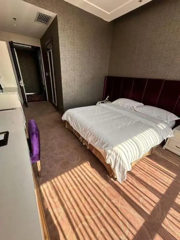 Bed in Harbin Ju Jian Hotel
