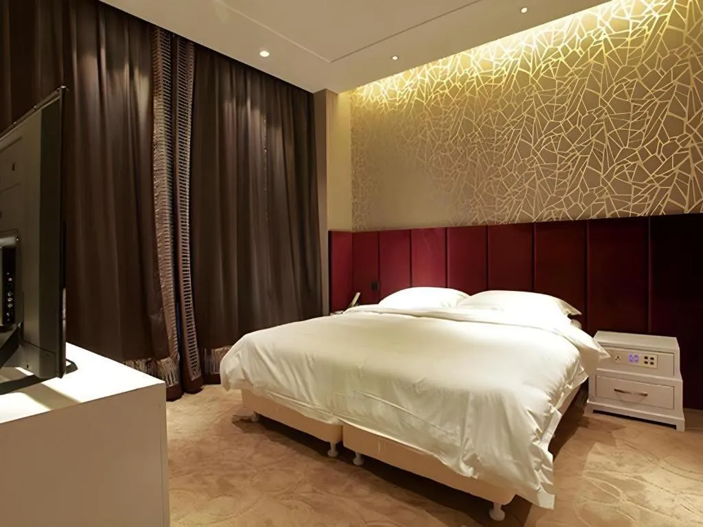 Bed in Harbin Ju Jian Hotel